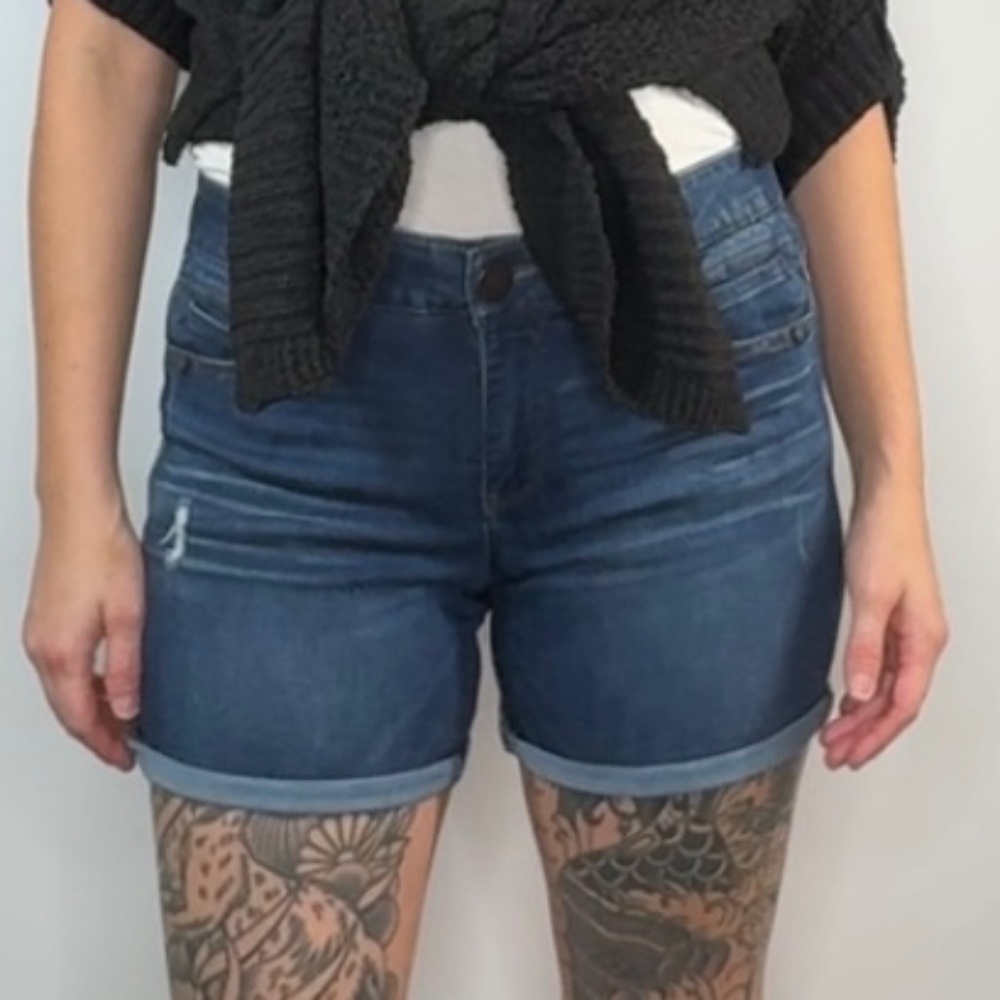 Democracy denim shorts in size 6 featuring the signature “A